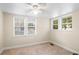 Cozy bedroom with carpet, ceiling fan and natural light from the three windows at 102 Deen Blvd, Auburndale, FL 33823