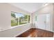 Bright entryway with hardwood floors, a large window, and a white front door with sidelights at 102 Deen Blvd, Auburndale, FL 33823