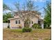 Charming two-story home featuring mature trees, a well-maintained lawn and a welcoming entrance at 102 Deen Blvd, Auburndale, FL 33823