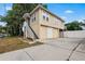Charming two-story home with a unique design and spacious driveway at 102 Deen Blvd, Auburndale, FL 33823