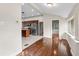 Open-concept kitchen view with wood floors, stainless steel appliances, and a center island at 102 Deen Blvd, Auburndale, FL 33823