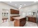 Bright kitchen featuring stainless steel appliances, a center island, and a convenient breakfast bar at 102 Deen Blvd, Auburndale, FL 33823