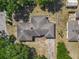 Aerial view of the property and the surrounding neighborhood with mature trees at 1024 Campbell Ave, Lake Wales, FL 33853