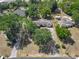 Aerial shot showcasing the property's layout and expansive lot size enclosed by a yellow border at 1024 Campbell Ave, Lake Wales, FL 33853