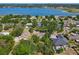 Aerial view of the property highlighting its proximity to a large, scenic lake and surrounding neighborhood at 1024 Campbell Ave, Lake Wales, FL 33853