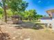 Expansive backyard featuring a gazebo and mature trees provides a private outdoor retreat at 1024 Campbell Ave, Lake Wales, FL 33853