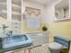 Bathroom with blue fixtures and unique tile flooring at 1024 Campbell Ave, Lake Wales, FL 33853