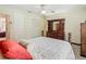 Bedroom features a ceiling fan and a view to the hallway at 1024 Campbell Ave, Lake Wales, FL 33853