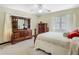 Bedroom with wood furniture, ceiling fan, and large windows at 1024 Campbell Ave, Lake Wales, FL 33853