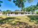 A single story home with a well-kept lawn and white exterior at 1024 Campbell Ave, Lake Wales, FL 33853