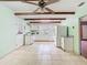 Bright kitchen with tile flooring, white cabinets, a vintage stove, and plenty of natural light at 1024 Campbell Ave, Lake Wales, FL 33853