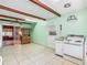 Spacious kitchen with wood beams and a door leading to the outside at 1024 Campbell Ave, Lake Wales, FL 33853