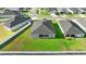 Aerial view showcasing the home's backyard, patio, and surrounding community at 1045 Montgomery Ln, Polk City, FL 33868