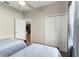Bedroom offers two twin beds, ceiling fan, closet and a door at 1045 Montgomery Ln, Polk City, FL 33868