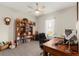 Functional home office with carpeting, a ceiling fan, a bookshelf, a desk, and a window for natural light at 1045 Montgomery Ln, Polk City, FL 33868
