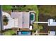Stunning aerial view of a waterfront property with a private pool and dock on a serene lake at 108 Lake Howard Dr Nw, Winter Haven, FL 33880