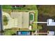 Aerial shot highlighting the property's lot, pool, waterfront access, and proximity to the lake at 108 Lake Howard Dr Nw, Winter Haven, FL 33880