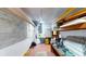 Unfinished basement space with block walls and overhead storage at 108 Lake Howard Dr Nw, Winter Haven, FL 33880