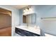 Bathroom featuring a vanity with a solid countertop and a large mirror at 108 Lake Howard Dr Nw, Winter Haven, FL 33880