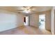 Bright bedroom with ceiling fan, closet, and ensuite bathroom at 108 Lake Howard Dr Nw, Winter Haven, FL 33880