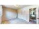 Bedroom featuring double closet and neutral walls and base trim at 108 Lake Howard Dr Nw, Winter Haven, FL 33880