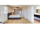 Carpeted bedroom featuring a ceiling fan, a window with shutters, and an ensuite bathroom at 108 Lake Howard Dr Nw, Winter Haven, FL 33880