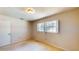 Bedroom featuring secure window and neutral walls and base trim at 108 Lake Howard Dr Nw, Winter Haven, FL 33880