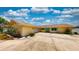 Beautiful yellow home with well-manicured landscaping and a long driveway with turquoise shutters at 108 Lake Howard Dr Nw, Winter Haven, FL 33880