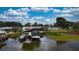 A waterfront home featuring a private dock and outdoor entertaining space at 108 Lake Howard Dr Nw, Winter Haven, FL 33880