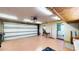 View of the spacious garage showing the automatic door opener and brick walls at 108 Lake Howard Dr Nw, Winter Haven, FL 33880