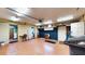 Spacious garage with brick accent wall and access to other rooms at 108 Lake Howard Dr Nw, Winter Haven, FL 33880