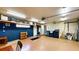 Garage featuring ample storage, painted brick, and a workbench at 108 Lake Howard Dr Nw, Winter Haven, FL 33880