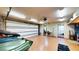 Spacious garage with automatic door and access to additional rooms at 108 Lake Howard Dr Nw, Winter Haven, FL 33880