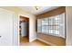 Hallway featuring tile flooring, white door and window with natural lighting at 108 Lake Howard Dr Nw, Winter Haven, FL 33880