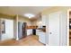 Spacious kitchen featuring stainless steel appliances, tile floors, and white cabinets at 108 Lake Howard Dr Nw, Winter Haven, FL 33880
