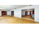 Large living area with tile floors, bedrooms, and views of the kitchen and pool at 108 Lake Howard Dr Nw, Winter Haven, FL 33880