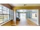 Bright living room with tile floors, open layout, and views of screened in pool at 108 Lake Howard Dr Nw, Winter Haven, FL 33880