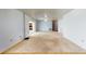 Spacious living room with large sliding doors and neutral carpeting at 108 Lake Howard Dr Nw, Winter Haven, FL 33880