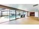 Screened in pool with views of the lake and outdoor seating area at 108 Lake Howard Dr Nw, Winter Haven, FL 33880