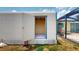 White shed with an open door next to a screened-in patio in a sunny backyard at 108 Lake Howard Dr Nw, Winter Haven, FL 33880