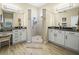 Elegant bathroom with dual sinks, granite countertops, and a glass-enclosed shower at 1104 Sawgrass Dr, Winter Haven, FL 33884