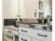 Bathroom detail featuring granite countertops and vanity with a decorative chair at 1104 Sawgrass Dr, Winter Haven, FL 33884