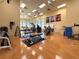Well-equipped fitness center with hardwood floors, ceiling fans and a variety of workout machines at 1104 Sawgrass Dr, Winter Haven, FL 33884