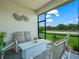 Inviting screened lanai with comfortable seating overlooking the landscaped backyard at 1104 Sawgrass Dr, Winter Haven, FL 33884