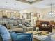 Open concept living room features updated lighting, furnishings and kitchen and dining area views at 1104 Sawgrass Dr, Winter Haven, FL 33884