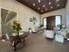 Grand lobby area with wood floors, coffered ceiling, and elegant seating arrangements at 1104 Sawgrass Dr, Winter Haven, FL 33884