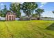 Large backyard features a above-ground pool, shed, and plenty of green space at 1221 Alameda S Dr, Lakeland, FL 33805