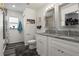 Well-lit bathroom with granite counters, double sinks, and a shower-tub combo at 1221 Alameda S Dr, Lakeland, FL 33805