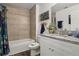 Clean bathroom with tiled shower, granite countertops and coastal accents at 1221 Alameda S Dr, Lakeland, FL 33805