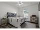 Serene bedroom with a comfortable bed, soft lighting, and vintage furnishings at 1221 Alameda S Dr, Lakeland, FL 33805